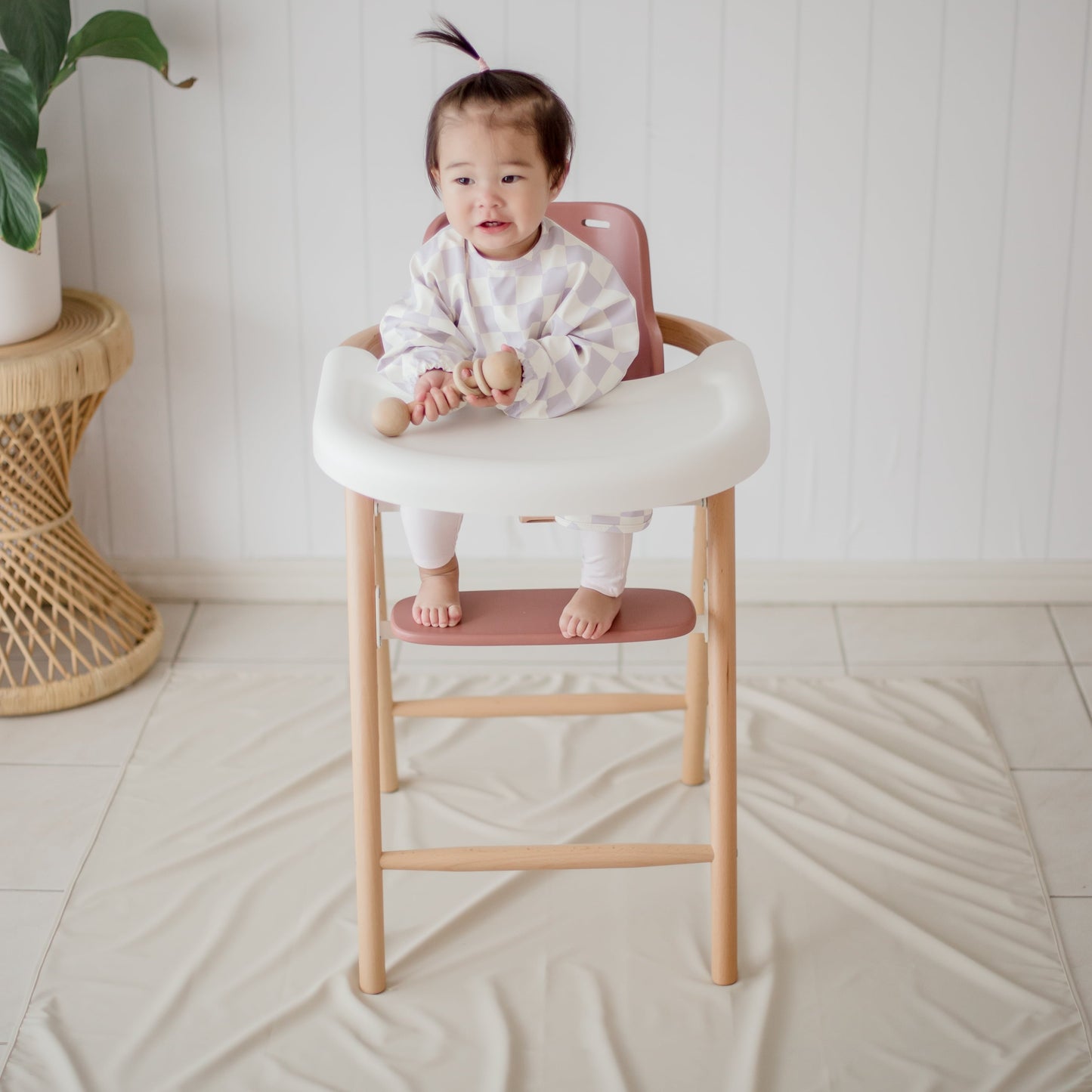 Ellie Bub Sand Messy Mat Underneath High Chair with baby in lilah smock
